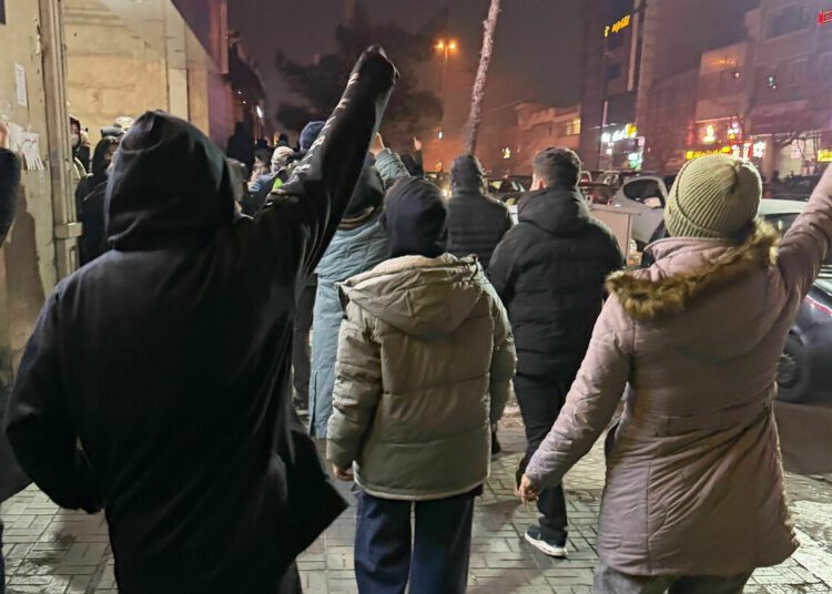 In this photo obtained by The Associated Press, protesters chant slogans during an anti-government protest in Tehran, Iran, Thursday, Jan. 8, 2026. (UGC via AP)